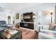 Stylish living room featuring a media center with built-in fireplace and modern furnishings at 1064 Blackbear Dr, Edisto Island, SC 29438