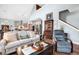 Open-concept living area with a cozy couch and seamless view into the modern kitchen at 1064 Blackbear Dr, Edisto Island, SC 29438