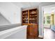 Open loft area featuring a large bookcase and view into bedroom at 1064 Blackbear Dr, Edisto Island, SC 29438