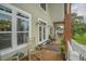 Welcoming porch with seating, plants, and decor, ideal for enjoying the outdoors and fresh air at 1064 Blackbear Dr, Edisto Island, SC 29438