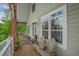 Inviting porch featuring wooden bench and views, perfect for outdoor relaxation and enjoyment at 1064 Blackbear Dr, Edisto Island, SC 29438