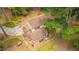 Aerial view of a home with a brick facade and a screened-in back porch in a wooded area at 110 Cantering Hills Ln, Summerville, SC 29483
