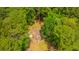 Aerial view showcases a home nestled amidst lush greenery, providing a private and serene setting surrounded by trees at 110 Cantering Hills Ln, Summerville, SC 29483