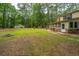 Large backyard featuring a detached garage, shed, and brick patio at 110 Cantering Hills Ln, Summerville, SC 29483