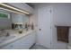 Bright bathroom with double sinks, white cabinets, and a large mirror at 110 Cantering Hills Ln, Summerville, SC 29483