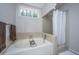 Large bathtub with a shower and window, plus a chrome faucet at 110 Cantering Hills Ln, Summerville, SC 29483