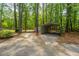 Carport provides covered parking and storage nestled in a wooded area at 110 Cantering Hills Ln, Summerville, SC 29483