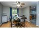 Dining room featuring hardwood floors, modern light fixture, table with seating for four, and view of backyard at 110 Cantering Hills Ln, Summerville, SC 29483