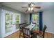 Dining room with hardwood floors, stylish table and chairs, and French doors opening to the outdoors at 110 Cantering Hills Ln, Summerville, SC 29483
