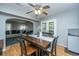 Dining room with hardwood floors, a ceiling fan, and view into the adjacent living room and backyard through french doors at 110 Cantering Hills Ln, Summerville, SC 29483
