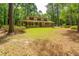 Charming two-story home with brick facade and welcoming front porch surrounded by lush greenery at 110 Cantering Hills Ln, Summerville, SC 29483