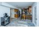 Open kitchen with wooden cabinets, stainless appliances, breakfast bar seating, and a view to the living area at 110 Cantering Hills Ln, Summerville, SC 29483