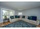 Inviting living room with a cozy sectional sofa, hardwood floors, and plenty of natural light at 110 Cantering Hills Ln, Summerville, SC 29483