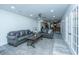 Comfortable living room featuring sleek gray couches, a coffee table, and access to the kitchen at 110 Cantering Hills Ln, Summerville, SC 29483