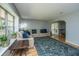 Bright living room featuring a comfortable sectional sofa, hardwood floors, and large windows at 110 Cantering Hills Ln, Summerville, SC 29483