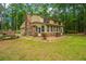Charming two-story home featuring a brick chimney and a sunroom addition at 110 Cantering Hills Ln, Summerville, SC 29483