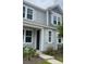 Charming two-story home boasts a stylish gray exterior and inviting white window shutters at 111 Brant Dr, Summerville, SC 29483