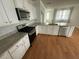 Modern kitchen featuring white cabinets, granite countertops, and stainless steel appliances at 111 Brant Dr, Summerville, SC 29483