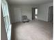 Spacious living room with neutral carpet, ample lighting, and multiple access points at 111 Brant Dr, Summerville, SC 29483