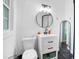Modern bathroom with black marble floors, vanity, sleek fixtures, and a framed mirror at 113 Overhill Dr, Walterboro, SC 29488