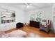 Bright bedroom boasts hardwood floors, white walls, built-in shelving, and natural light at 113 Overhill Dr, Walterboro, SC 29488