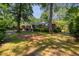 Charming brick home surrounded by mature trees and a lush green lawn at 113 Overhill Dr, Walterboro, SC 29488