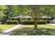 Charming brick home with a manicured lawn, mature shade trees, and a welcoming front entrance at 113 Overhill Dr, Walterboro, SC 29488