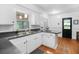 Bright kitchen featuring granite countertops, stainless steel sink and fixtures, and ample counter space at 113 Overhill Dr, Walterboro, SC 29488