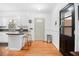 Charming kitchen with granite countertops, white cabinets, and a breakfast bar island with stool seating at 113 Overhill Dr, Walterboro, SC 29488