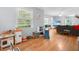 Bright, open living room with hardwood floors, large windows, and ample space for both play and relaxation at 113 Overhill Dr, Walterboro, SC 29488