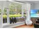 Bright living room features a window seat with scenic outdoor views and hardwood flooring at 113 Overhill Dr, Walterboro, SC 29488