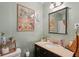 Bright bathroom with neutral green walls and a unique framed picture at 1160 Landsdowne Dr, Charleston, SC 29412