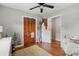 The bedroom offers hardwood floors, a ceiling fan, and a convenient closet at 1160 Landsdowne Dr, Charleston, SC 29412