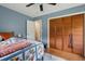 Bedroom with hardwood floors and a closet with paneled doors at 1160 Landsdowne Dr, Charleston, SC 29412