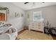 Cozy bedroom with bright natural light, modern dresser, and tastefully decorated with cute animal pictures at 1160 Landsdowne Dr, Charleston, SC 29412