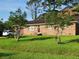 Well-maintained brick home with a lush green lawn and inviting curb appeal at 1160 Landsdowne Dr, Charleston, SC 29412
