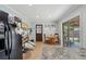 Bright eat-in kitchen featuring a dining table, access to the backyard, and modern appliances at 1160 Landsdowne Dr, Charleston, SC 29412