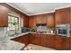 Charming kitchen featuring wooden cabinets, tiled backsplash, updated countertops, and plenty of natural light at 1160 Landsdowne Dr, Charleston, SC 29412