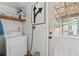 Bright laundry room offers a washer and dryer, shelf, and an exterior door with ample light at 1160 Landsdowne Dr, Charleston, SC 29412