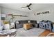 Cozy living room featuring a comfortable sectional sofa, ceiling fan, and stylish decor at 1160 Landsdowne Dr, Charleston, SC 29412