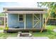 Charming outbuilding features a covered porch and a functional design that enhances the backyard at 1160 Landsdowne Dr, Charleston, SC 29412
