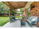 Cozy covered patio with stylish furniture, offering a relaxing outdoor living space at 1160 Landsdowne Dr, Charleston, SC 29412