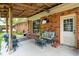 Inviting covered patio with comfortable seating, perfect for relaxing and entertaining guests at 1160 Landsdowne Dr, Charleston, SC 29412