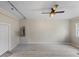 Unfinished basement providing ample storage space and featuring durable floors and a ceiling fan at 121 Harrison St, Varnville, SC 29944