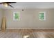 Spacious bedroom featuring windows and wood-look flooring at 121 Harrison St, Varnville, SC 29944