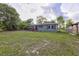Single-story home with a large front yard at 121 Harrison St, Varnville, SC 29944
