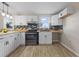 Well-lit kitchen with white cabinets, and butcher block counters at 121 Harrison St, Varnville, SC 29944
