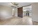 Open-concept living space with luxury vinyl flooring and a sliding barn door at 121 Harrison St, Varnville, SC 29944