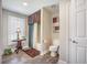 Charming bathroom with decorative shower curtain, window and patterned accent wall at 127 Travis Hill Rd, Moncks Corner, SC 29461