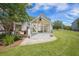 Exterior of greenhouse surrounded by grass, plants and mulch with part of home in background at 127 Travis Hill Rd, Moncks Corner, SC 29461